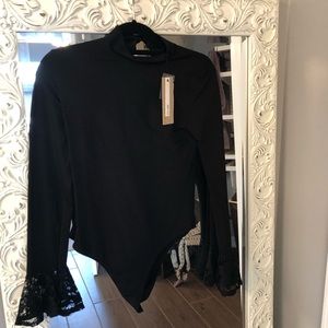 A black lace body suit